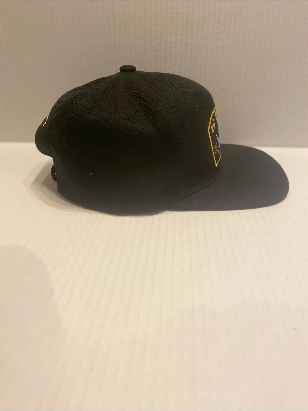 No Quarter Black & Gold Skull Patch Snapback Hat
